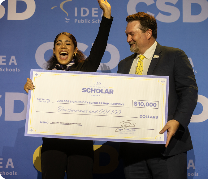 Student scholarship award presentation at an IDEA Promise Foundation event.